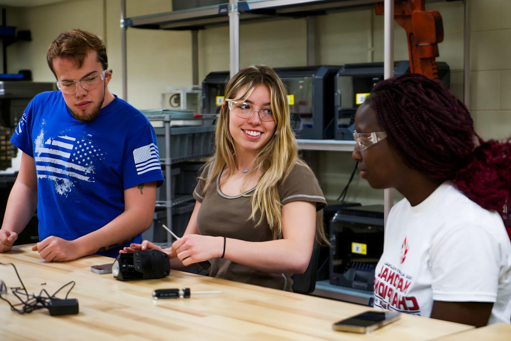 Engineering majors working  on a project.